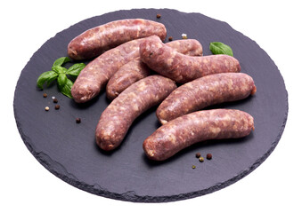Raw beef or pork grill sausage on stone serving board isolated