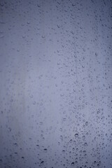 background of a light gray iron shiny sheet of iron, after the rain with dew drops, after the rain, the texture of water drops on a steel sheet with a shadow