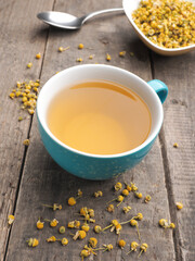Tasty organic chamomile tea with dried chamomile flowers