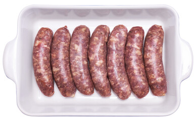 Raw beef or pork grill sausage in baking dish isolated