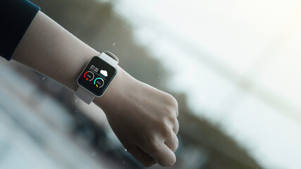 Close-up on smart watch wear on wrist screen show heartbeat tracking technology, walking step,...