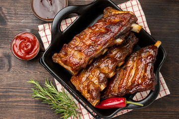 Grilled ribs with barbecue sauce and ketchup	
