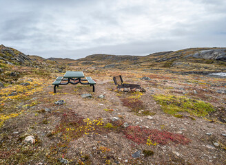 View of a picnic table and grill on the tundra at Sylvia Grinnell Territorial Park, Nunavut