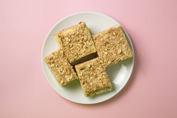 Cake slices on a pink background. Delicious homemade cake.