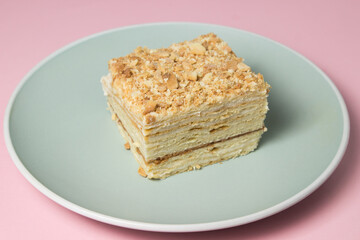 Cake slices on a pink background. Delicious homemade cake.
