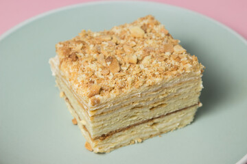 Cake slices on a pink background. Delicious homemade cake.