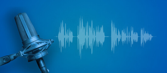 Blue microphone with audio waveform on blue background, recording studio, broadcasting or...