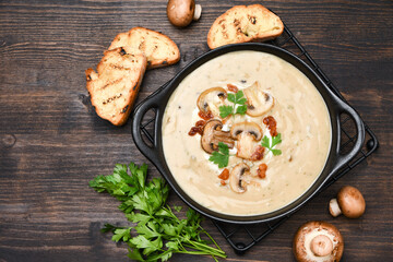Mushroom soup with bread and fresh mushrooms, autumn seasonal cream soup with vegetables