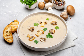 Mushroom soup with bread and fresh mushrooms, autumn seasonal cream soup with vegetables
