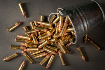 Rimfire cartridges scattered from a tin can. .22lr pest control. Top view,