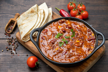 Bean and corn soup or ragout, red bean stew on a wooden background. Food Protein Vegan dish