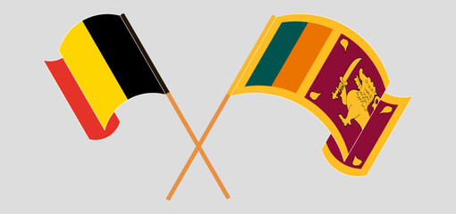 Crossed and waving flags of Belgium and Sri Lanka