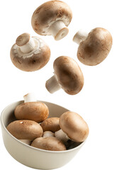 Fresh mushrooms falling into bowl
