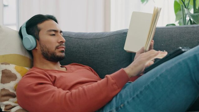 A man in home listening to music, studying and taking notes from digital eLearning course. Focus on your mental health, physical wellness and embrace online learning to make your life more productive
