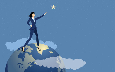 Businesswoman stands on globe and grabs a star