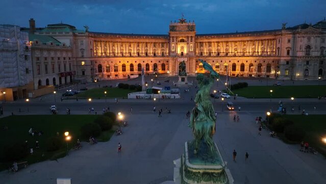 Vienna aerial night view, Hofburg palace facade illuminated, Heldenplatz square in downtown Vienna in the evening