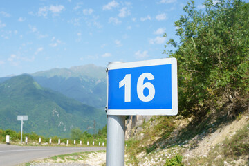 Blue road sign with the number 