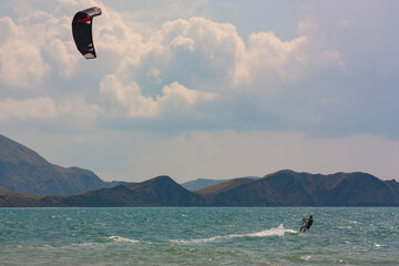 riding the kite in the sea on the waves