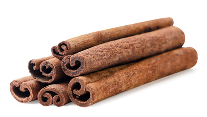 Heap of cinnamon sticks on a white background. Isolated