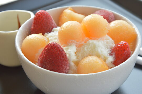 Bingsu dessert, fruit bingsu strawberry and rmelon with milk cream menu eat cooling sweet iced served .