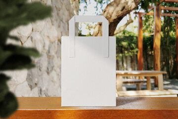 Clean minimal paper bag mockup on wooden bar with plant