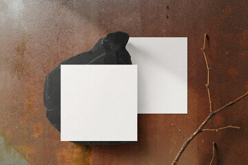 Clean minimal square flyer mockup on black stone with stick