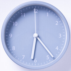 Gray alarm clock on white background.