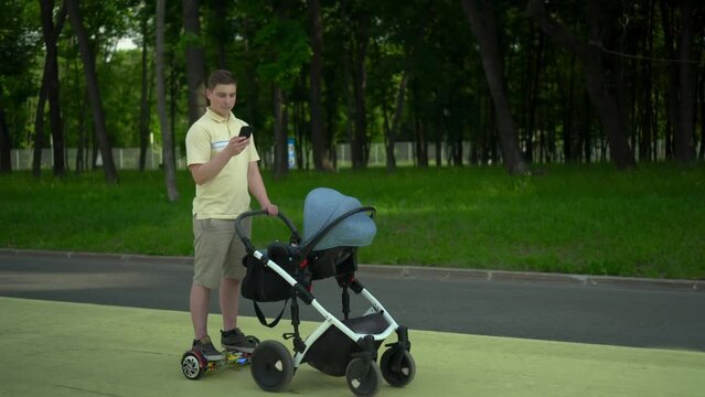 A young man rides a gyroscooter with a stroller