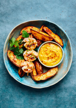 Spicy potato, wellow romesco and grilled shrimps
