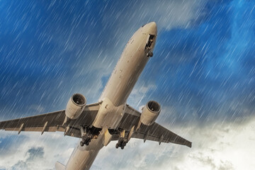 Fototapeta na wymiar Airplane takes off rapidly during in bad weather storm hurricane rain llightning strike.