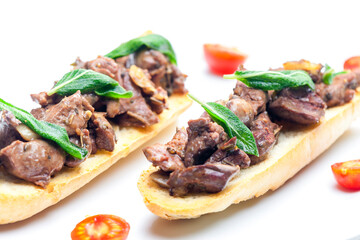 roasted livers on toasted baguette with sage leaves