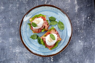 toasts with poached egg and bacon