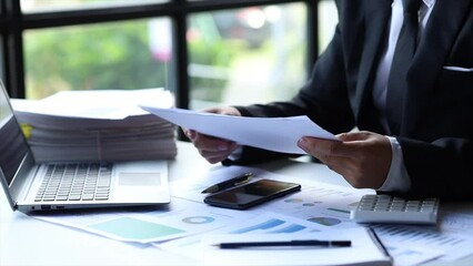Company finance staff preparing financial documents, company finance staff preparing company finance documents to bring to the meeting to summarize for management's acknowledgment. Financial concept.