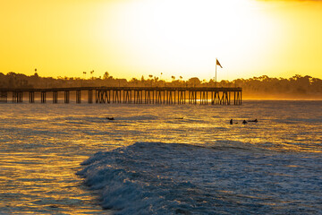 Obraz premium Surfing at Sunrise, Ventura, CA. USA