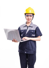 A female worker in a hard hat and uniform holding a computer