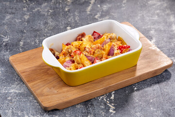 roasted vegetables with meat and cheese