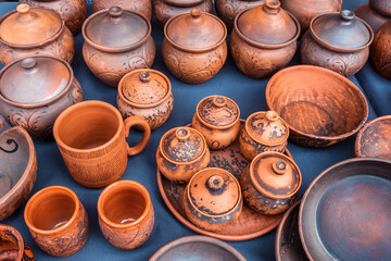 Handmade red clay tableware is sold at the street market. Home inventory