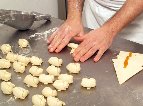 Pastry chef preparing and making peach marmelade mini briosh