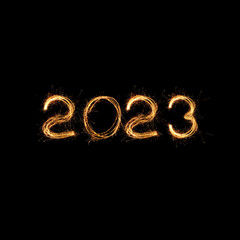 New Year 2023 light. Sparklers draw figures 2023. Bengal lights and letter. Golden