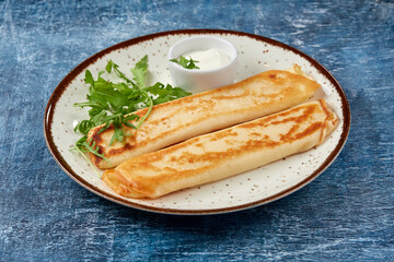 tasty breakfast with pancakes and herbs