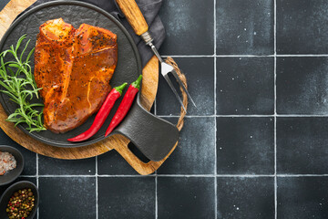 Raw steak t-bone or porterhouse. Steak t-bone or porterhouse in sauce with spices, salt and...