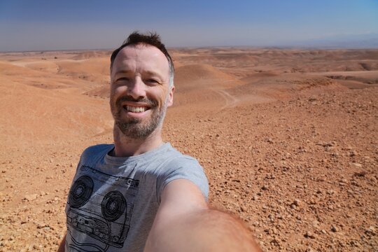 Morocco tourist selfie. Agafay desert traveler.