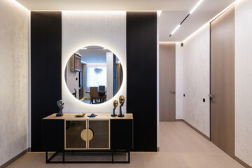 interior design of a corridor with decorative elements and a mirror