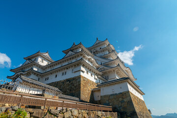 Fototapeta na wymiar Himeji Castle fortification against blue skies in Himeji, Hyogo Prefecture, Japan.