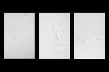 Three white sheets of paper isolated on a black background.