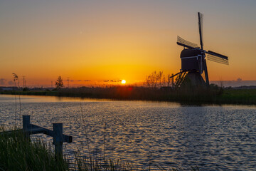 Sunset with windmill Broekmolen, Molenlanden - Nieuwpoort, The Netherlands