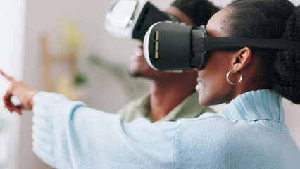 Futuristic couple with VR or virtual reality glasses excited with interface in home living room. Metaverse, future and tech of gamer black people with ai 3D simulation video game software app - Powered by Adobe