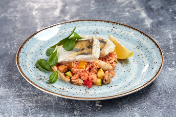 white fish with rice and vegetables