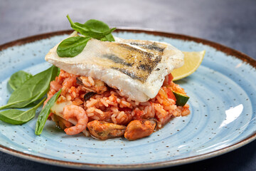 white fish with rice and vegetables
