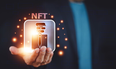 Businessman with smartphone holding digital unique art NFT hologram on circuit board binary...